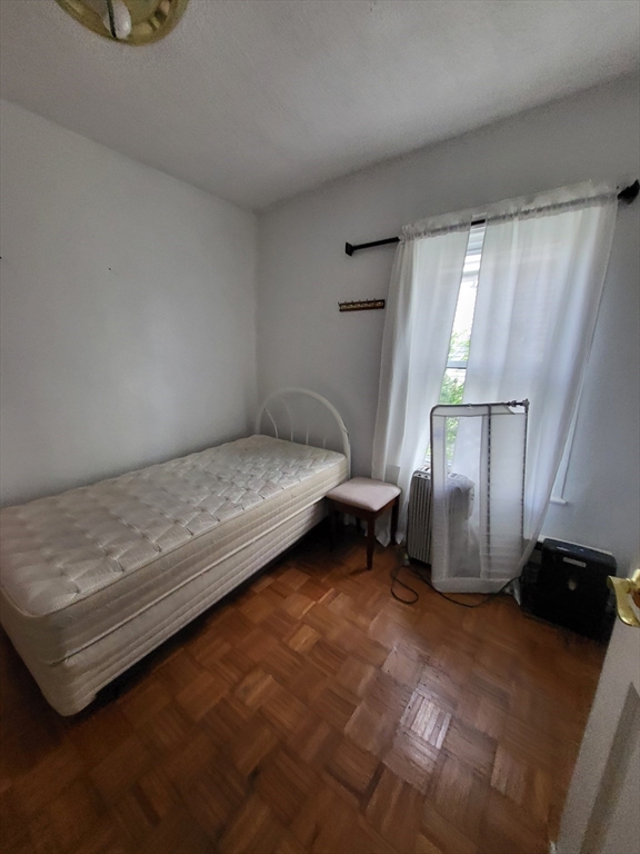 315 Main Street Everett, MA 02149 - Photo 15 of 37 a bedroom with a bed and a window