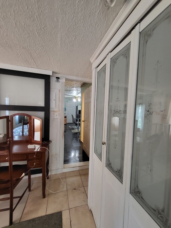 315 Main Street Everett, MA 02149 - Photo 17 of 37 a bathroom with a glass door shower and a sink