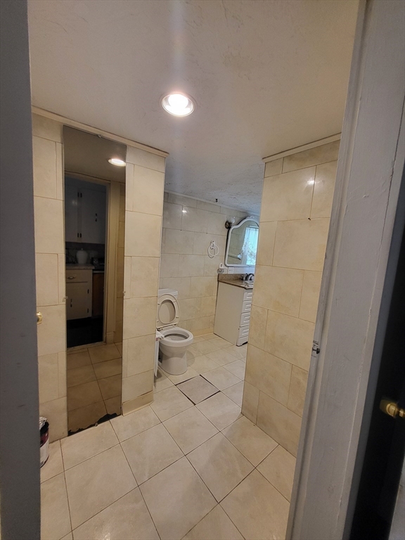 315 Main Street Everett, MA 02149 - Photo 21 of 37 a bathroom with a toilet and a shower