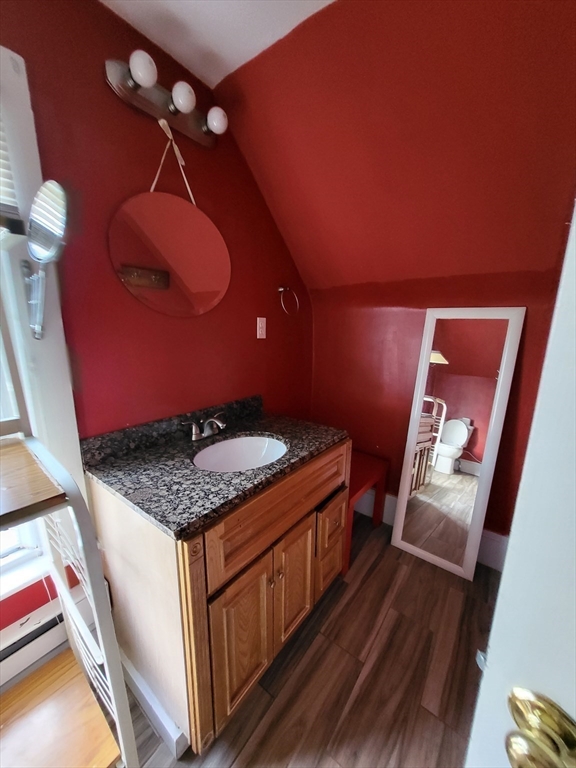 315 Main Street Everett, MA 02149 - Photo 33 of 37 a bathroom with a granite countertop sink and a mirror