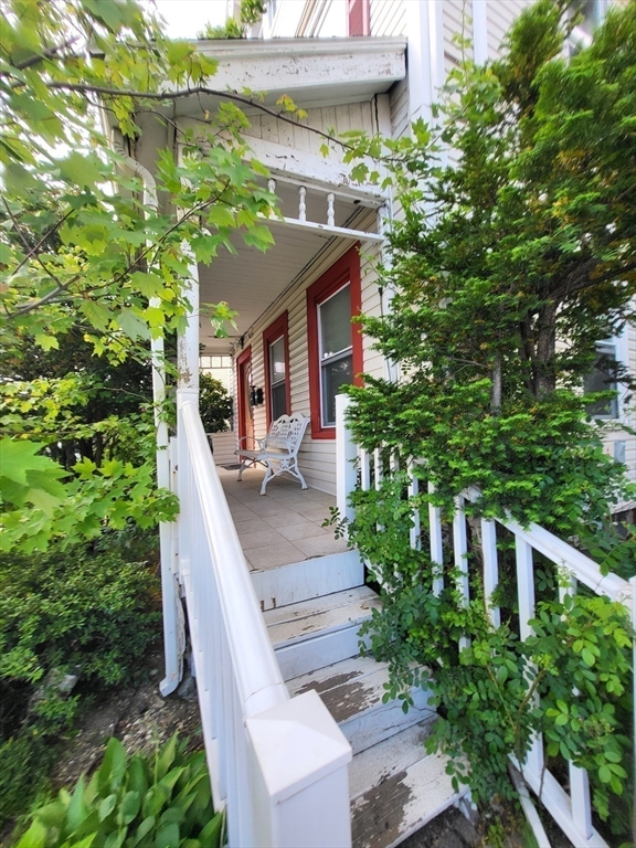 315 Main Street Everett, MA 02149 - Photo 34 of 37 a view of a house with brick walls and potted plants