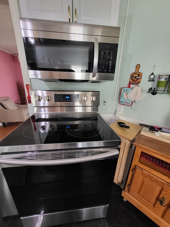 315 Main Street Everett, MA 02149 - Photo 4 of 37 a stove top oven sitting inside of a kitchen