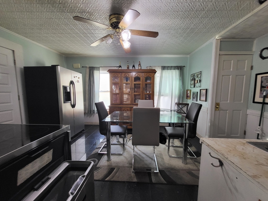 315 Main Street Everett, MA 02149 - Photo 6 of 37 a view of a dining room with furniture