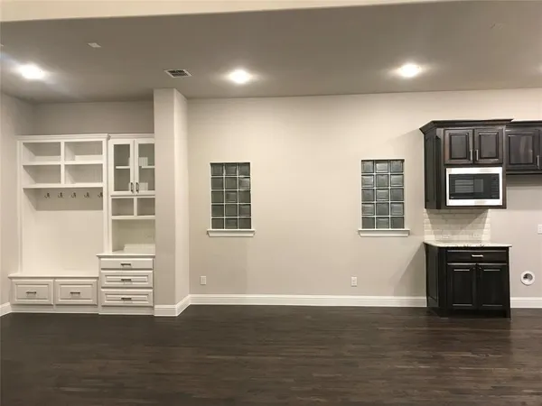 a bathroom with sink mirror and vanity
