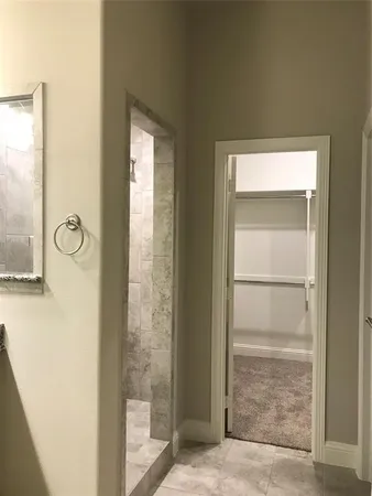 a bathroom with a granite countertop toilet a sink and a bathtub