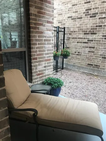 a front view of a house with a yard and plants