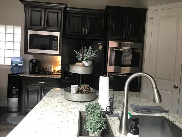 a kitchen with a sink and cabinets