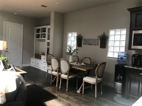 a dining room with furniture and window