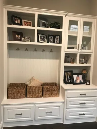 a living room with furniture and a ceiling fan
