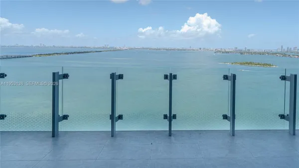 a view of a hallway with windows