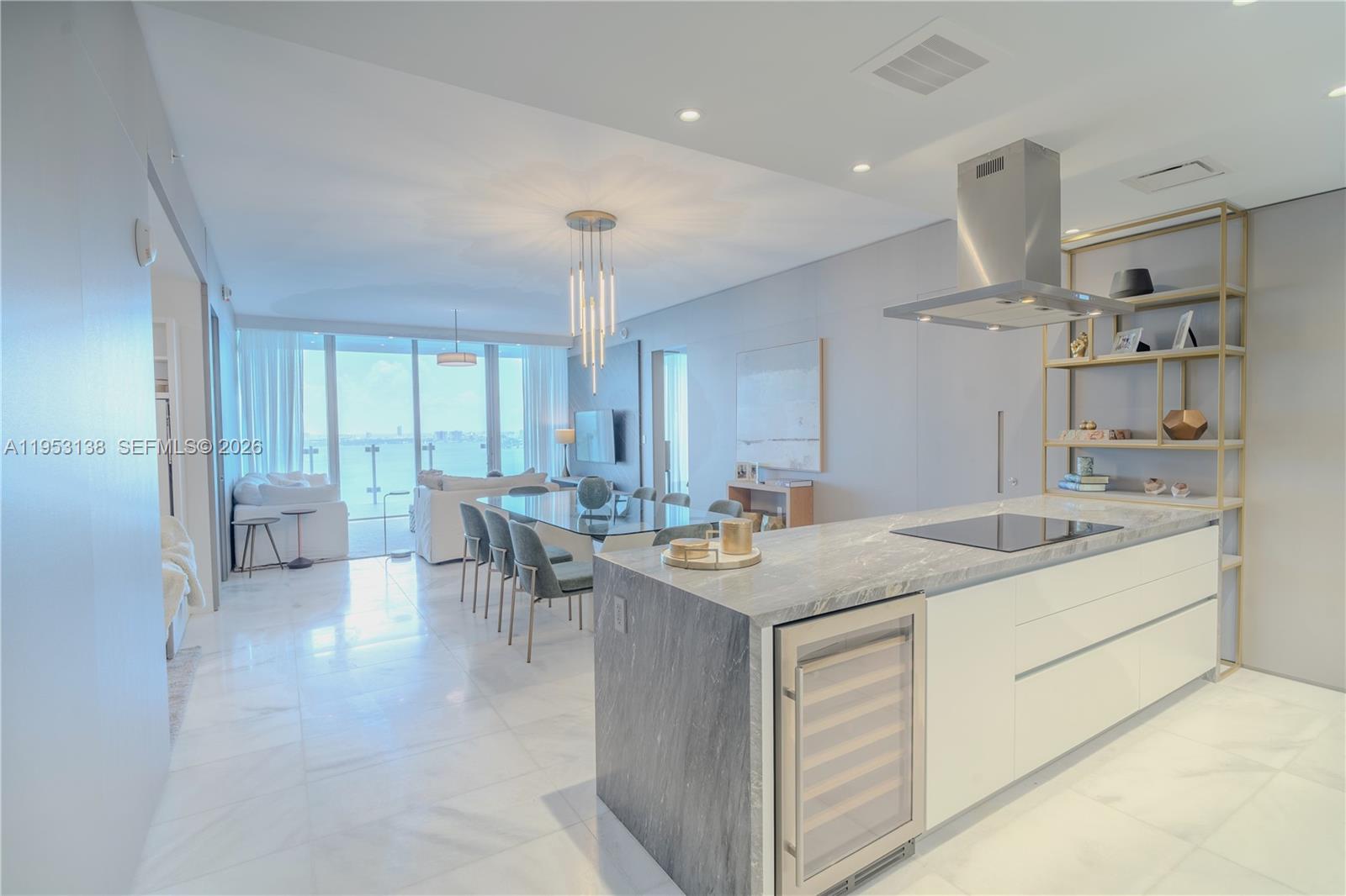 700 Northeast 26th Terrace, Unit 2602 Miami, FL 33137 - Photo 12 of 43 a kitchen with a sink stove and cabinets