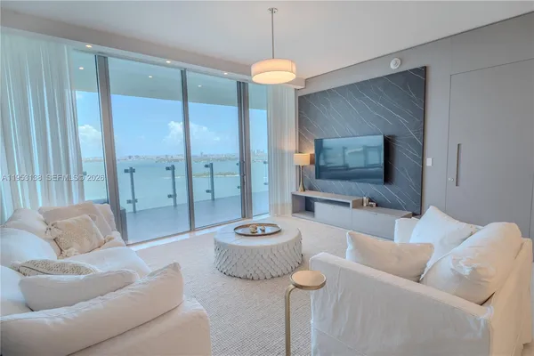 a living room with furniture and a window