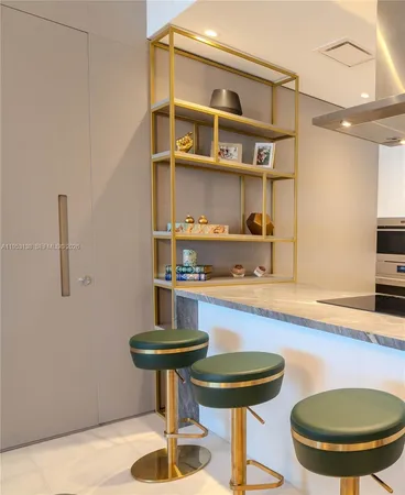 a kitchen with kitchen island stainless steel appliances a sink counter space and appliances