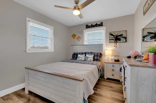 a living room with baby toys and dresser