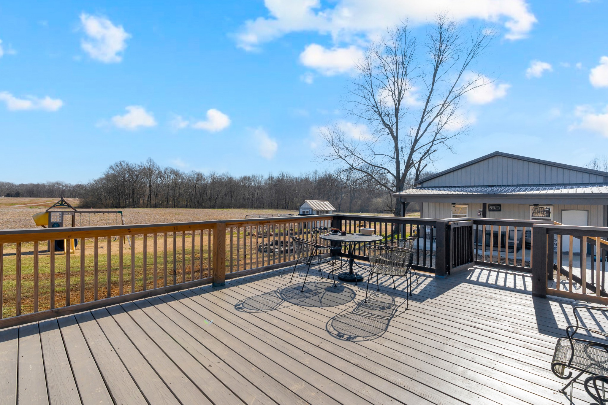 52 Hotel Road Flintville, TN 37335 - Photo 28 of 48 a view of a deck with wooden floor and fence with a barbeque