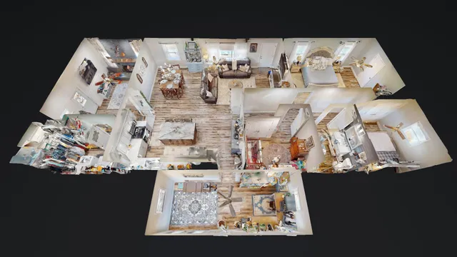 a living room with furniture and a view of kitchen