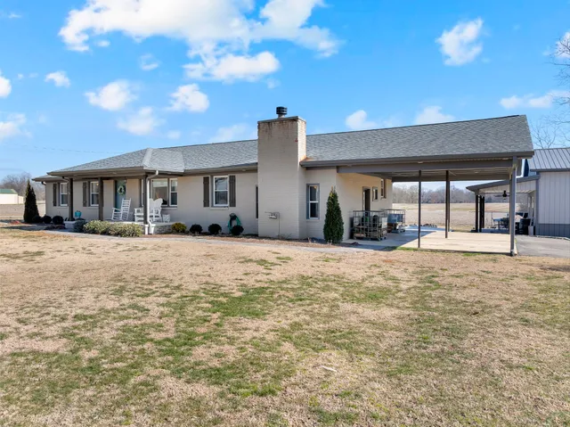 a view of a swimming pool and lounge chair