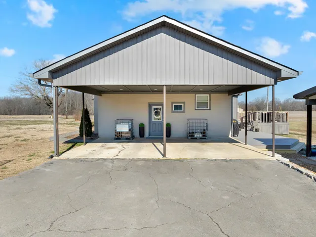 a view of a backyard of the house