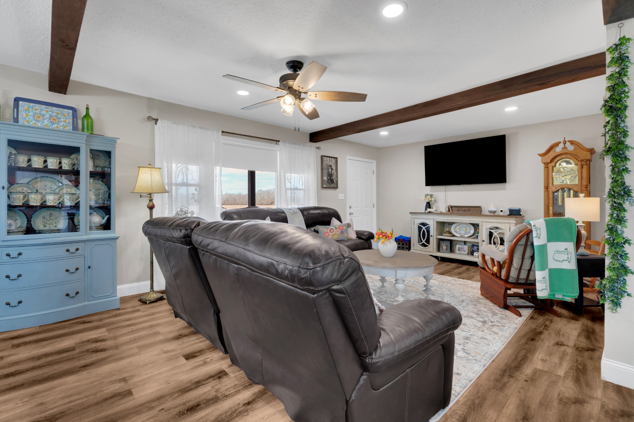 52 Hotel Road Flintville, TN 37335 - Photo 5 of 48 a living room with furniture a flat screen tv and a floor to ceiling window