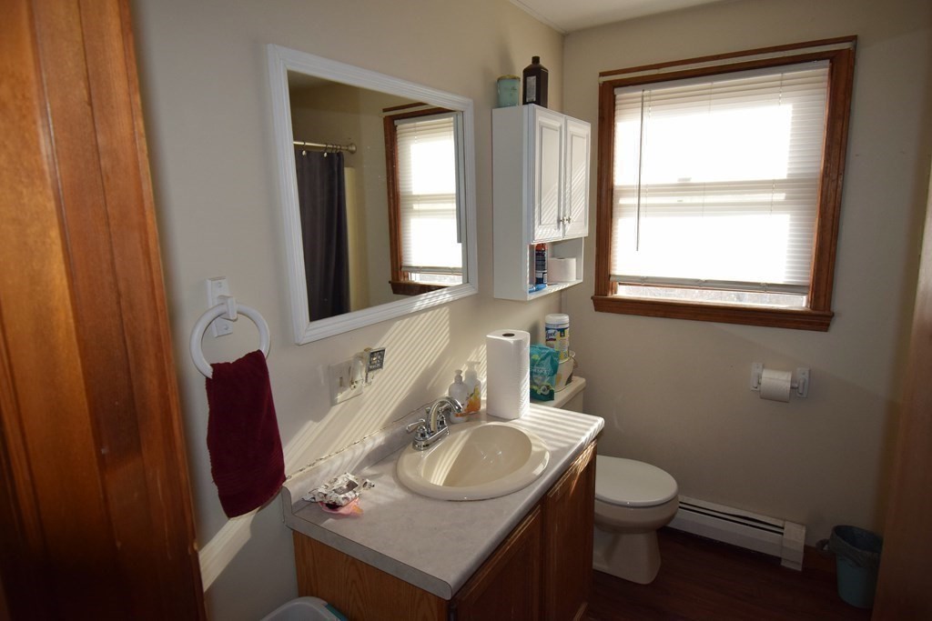 230 Chester Road Fremont, NH 03044 - Photo 16 of 30 a bathroom with a sink vanity mirror and toilet