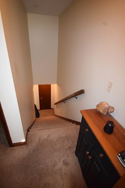 230 Chester Road Fremont, NH 03044 - Photo 21 of 30 a bedroom with a bed and a window