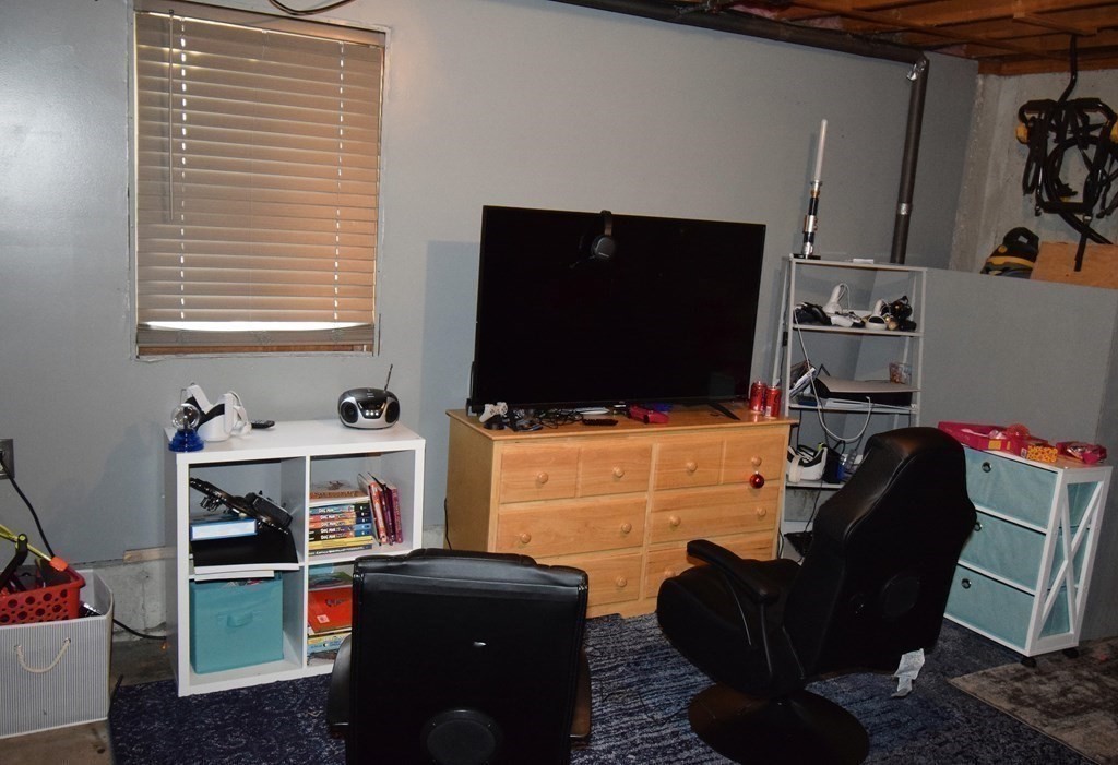 230 Chester Road Fremont, NH 03044 - Photo 24 of 30 a room with furniture and a flat screen tv
