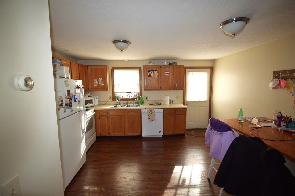 230 Chester Road Fremont, NH 03044 - Photo 7 of 30 a kitchen with granite countertop lots of counter top space and sink