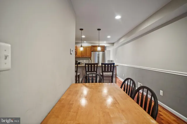 a view of a hallway with seating area