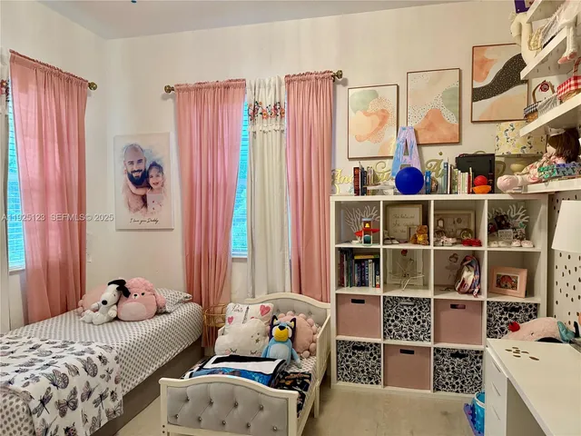 a bed room with a bed and a window