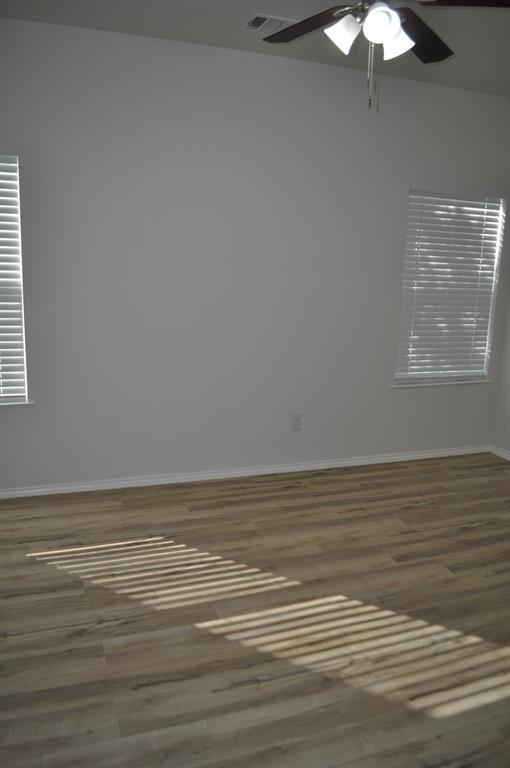 2321 Murphy Court Red Oak, TX 75154 - Photo 14 of 21 a view of a room with wooden floor and a chandelier