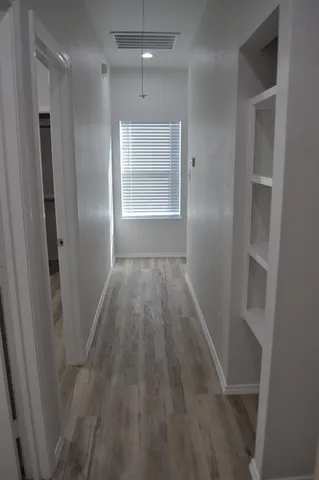 a bath room with a toilet and a bath tub