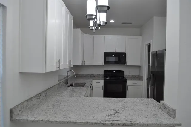 a view of entryway with wooden floor and stairs