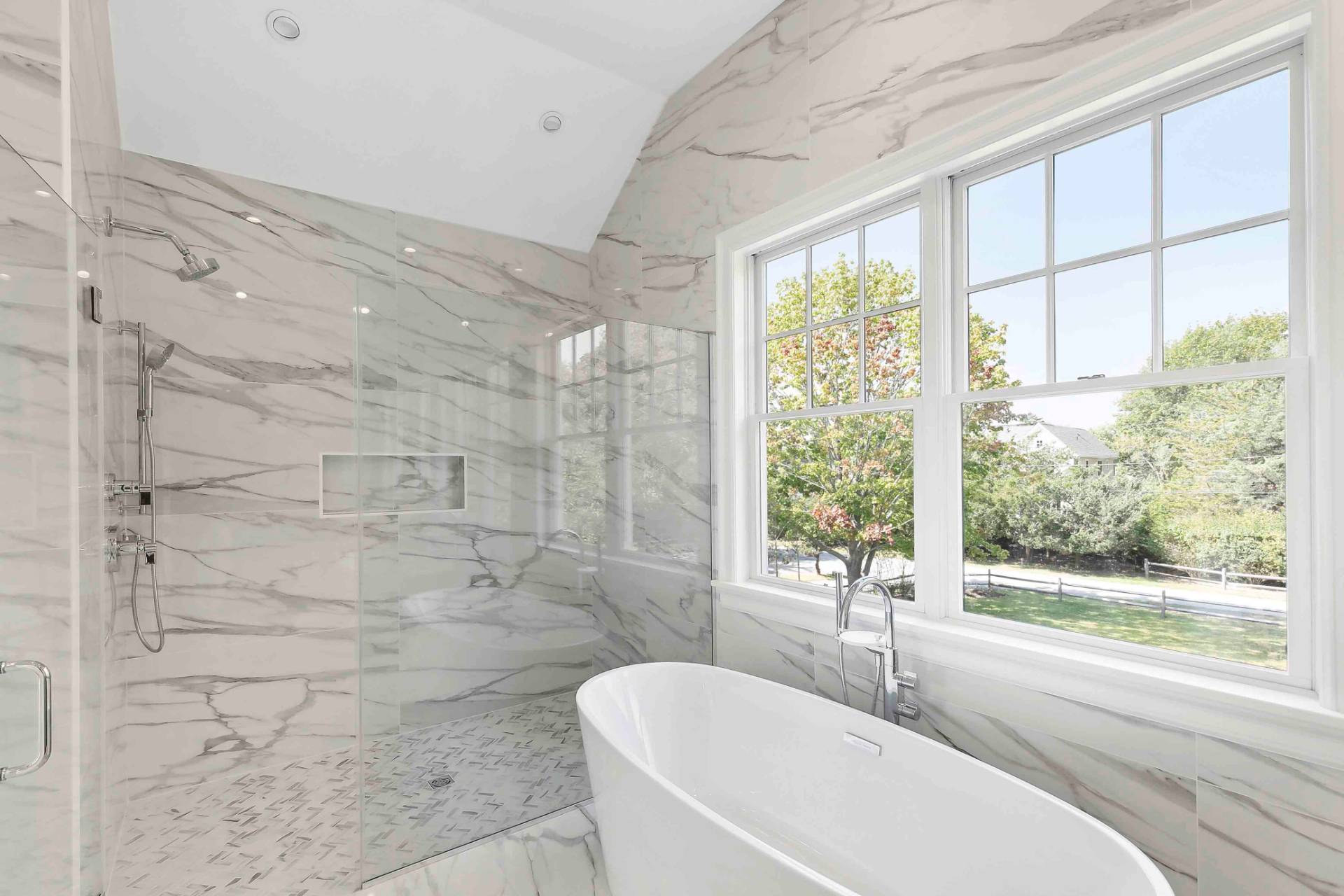 10 Cedar Lane Westhampton, NY 11977 - Photo 13 of 29 a bathroom with a granite countertop sink a large mirror and a bathtub