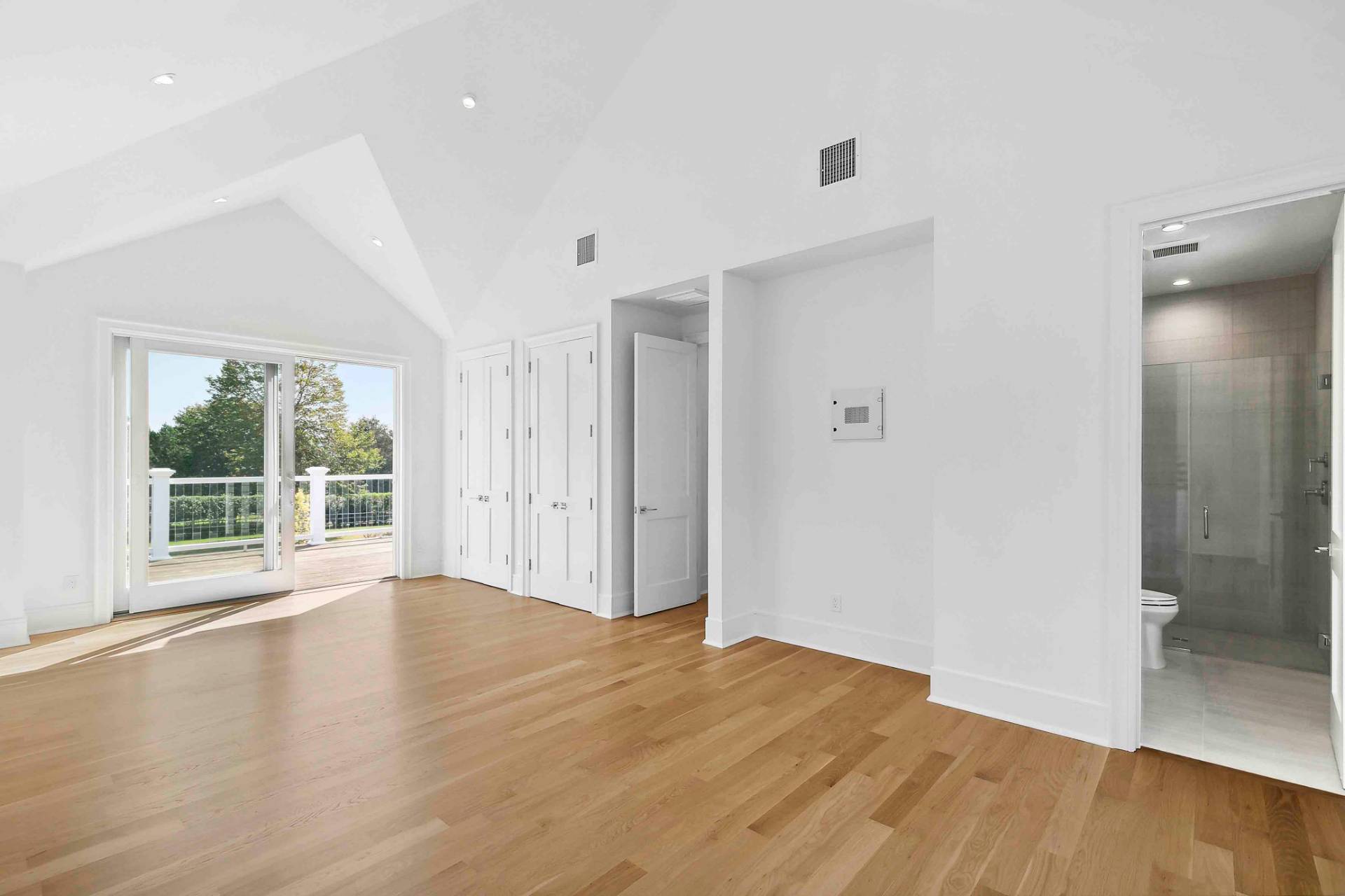 10 Cedar Lane Westhampton, NY 11977 - Photo 16 of 29 a view of empty room with wooden floor and fan