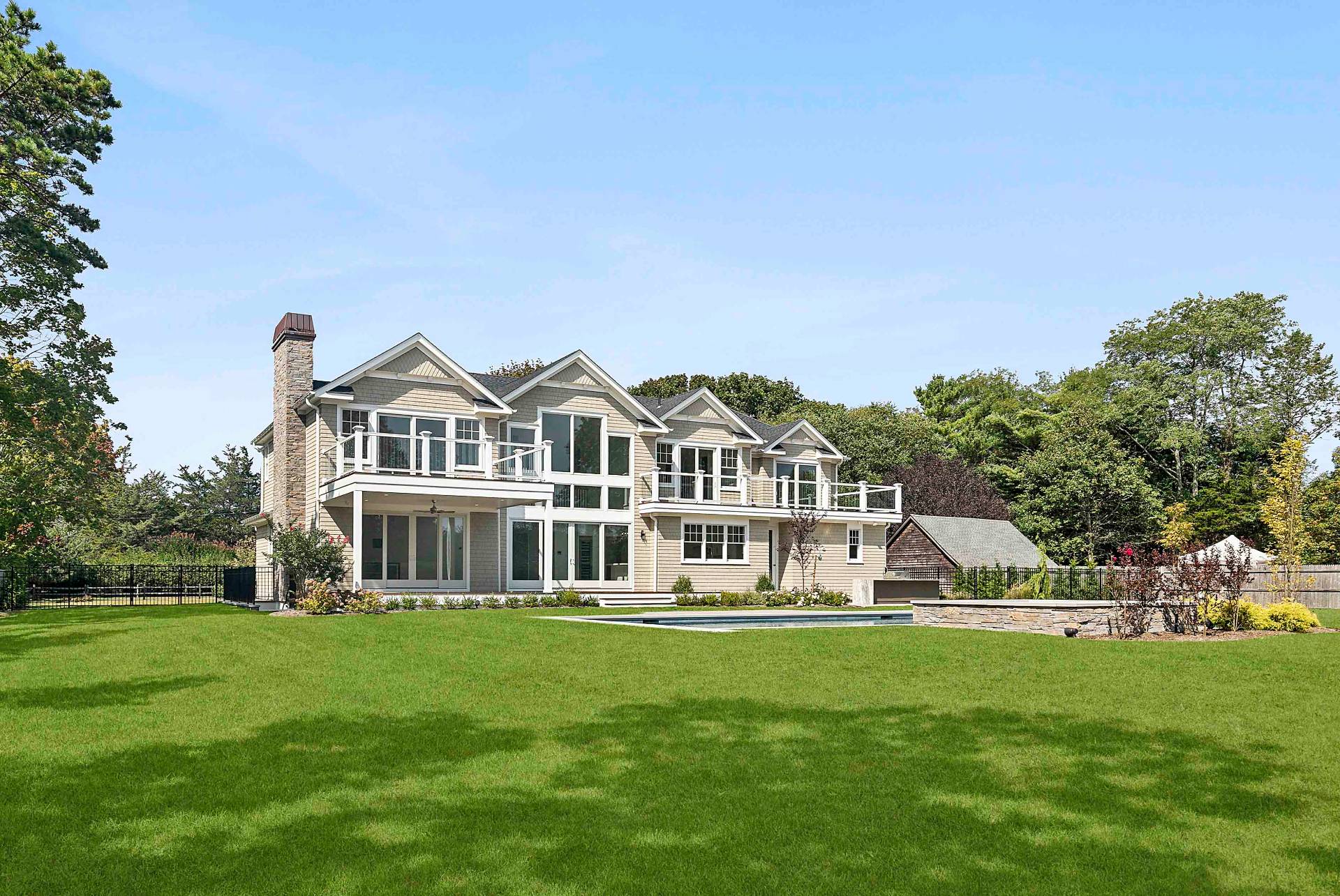10 Cedar Lane Westhampton, NY 11977 - Photo 21 of 29 a front view of a house with a yard
