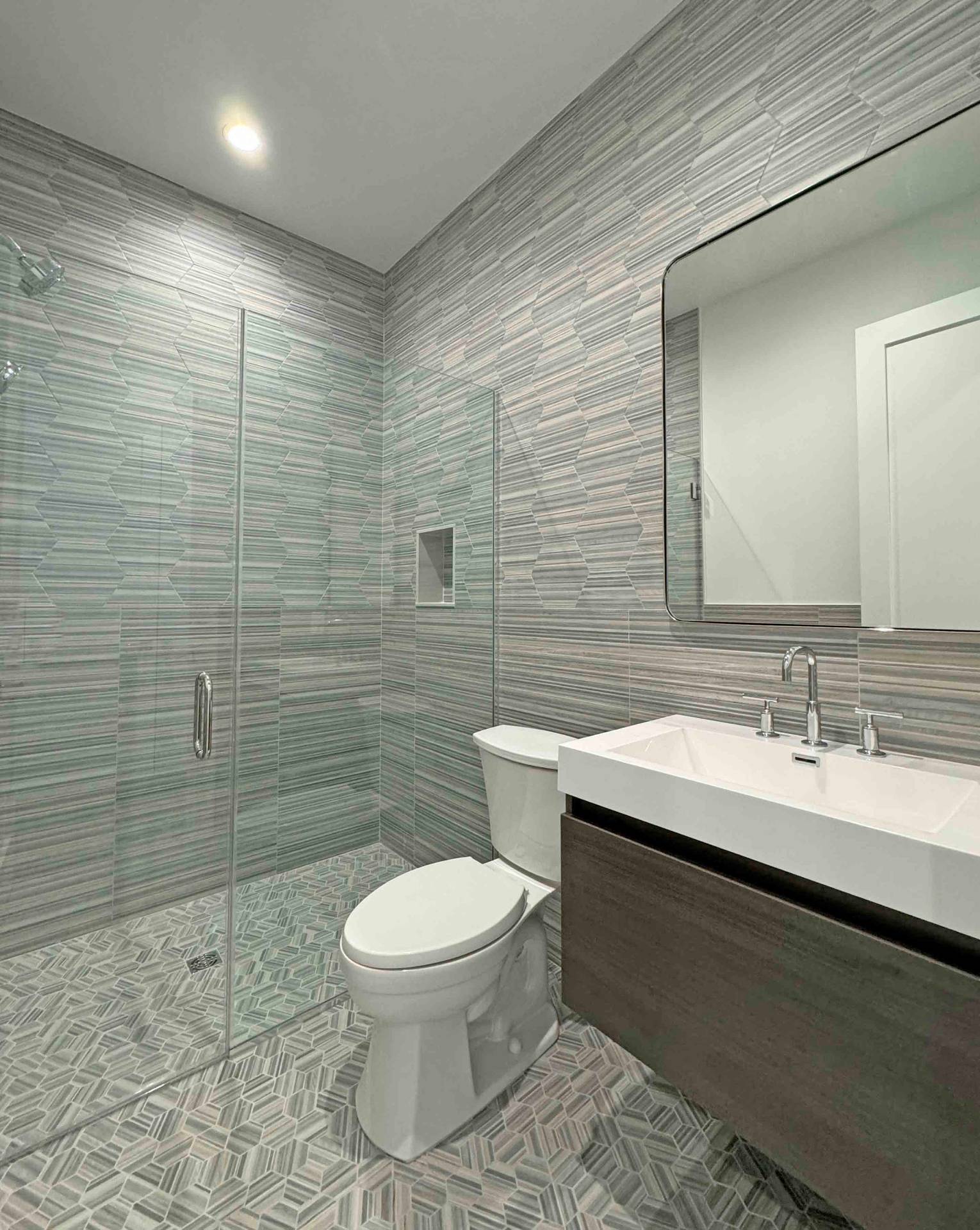 10 Cedar Lane Westhampton, NY 11977 - Photo 28 of 29 a bathroom with a toilet a sink and mirror