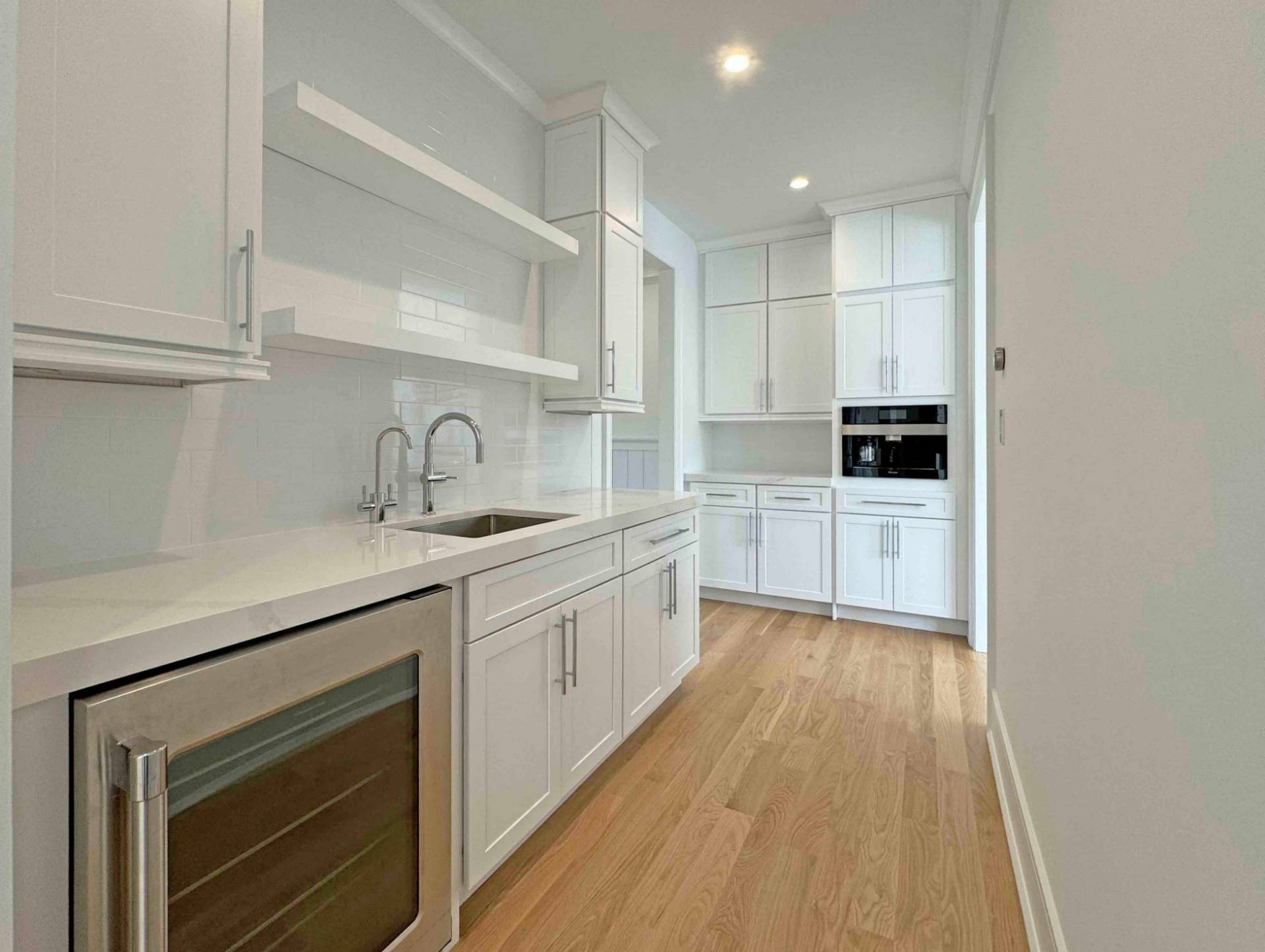 10 Cedar Lane Westhampton, NY 11977 - Photo 29 of 29 a kitchen with sink a microwave and cabinets
