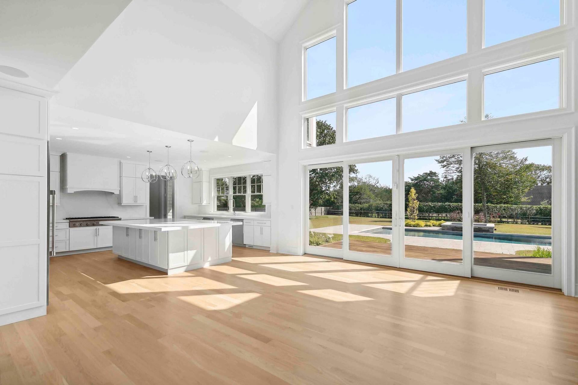 10 Cedar Lane Westhampton, NY 11977 - Photo 7 of 29 a view of a kitchen with granite countertop a large window and a view of living room
