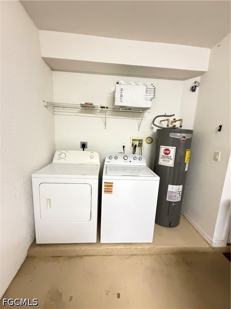 8541 Athena Court Lehigh Acres, FL 33971 - Photo 16 of 17 a utility room with dryer and washer