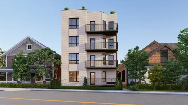 a view of multiple houses with a street