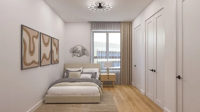 a bedroom with a bed and a chandelier