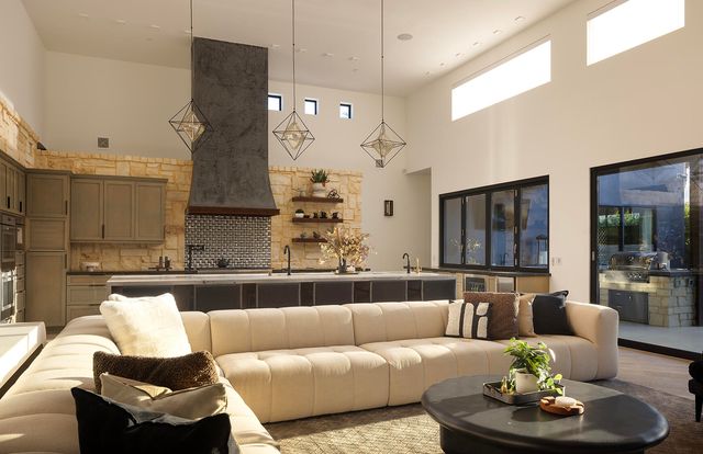 a kitchen with stainless steel appliances a sink and a stove