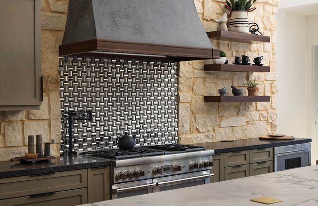 a bathroom with a sink a mirror and shower