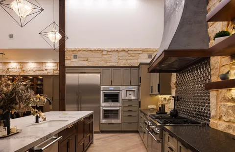 a bedroom with furniture and a large window