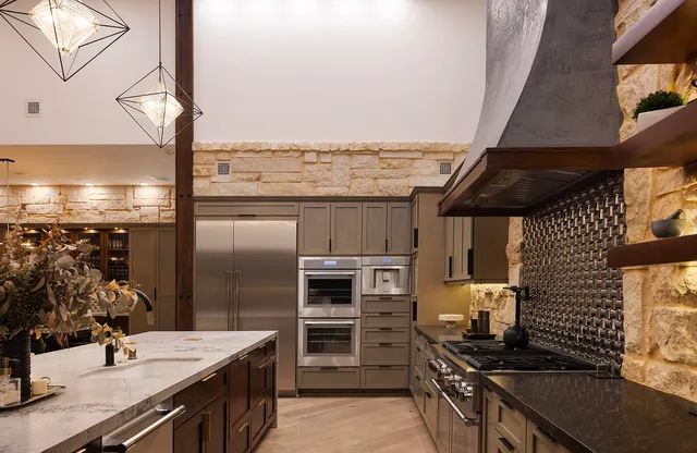 a bedroom with furniture and a large window