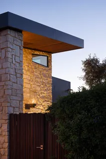 a living room with fireplace furniture and a floor to ceiling window