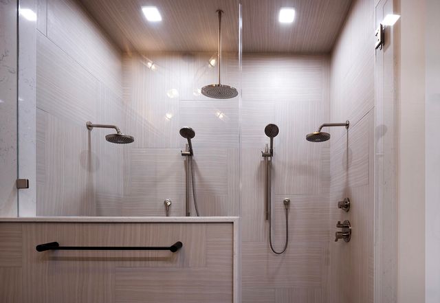 a living room with a table chairs and a large window