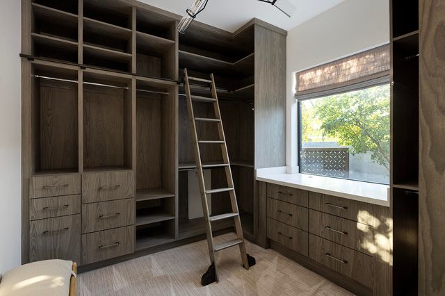 a kitchen with a sink cabinets and stainless steel appliances