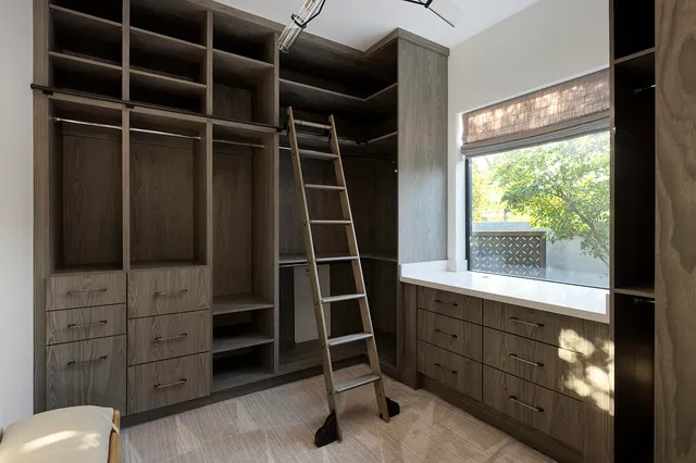 a kitchen with a sink cabinets and stainless steel appliances