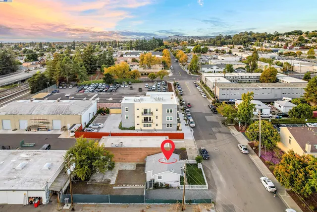 an aerial view of residential houses with outdoor space